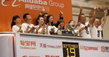 Alibaba representatives applaud as the opening bell of the New York Stock Exchange is rung, before the initial public offering (IPO) of Alibaba Group Holding Ltd under the ticker "BABA" in New York