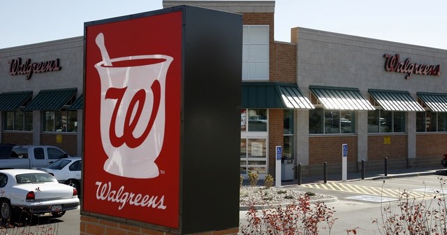 A customer drives away from the Walgreens in Westminster