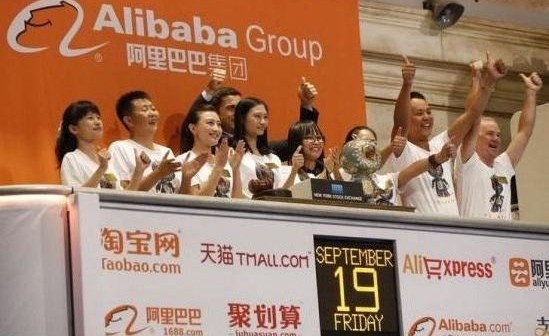 Alibaba representatives applaud as the opening bell of the New York Stock Exchange is rung, before the initial public offering (IPO) of Alibaba Group Holding Ltd under the ticker "BABA" in New York